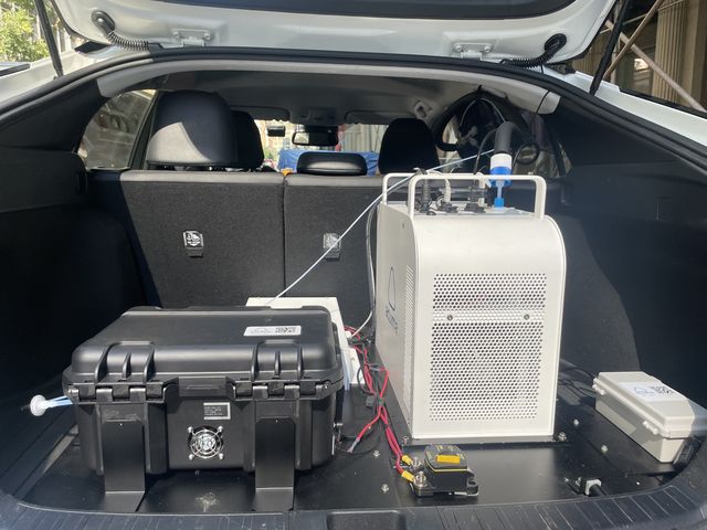 In the trunk is "where the magic happens" according to Aclima's fleet manager, Erald Xhaferaj. The big black box measures methane. The smaller box is the black carbon instrument. The data is measured every second and sent in real time.